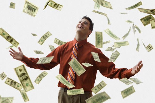 Money Falling on Happy Businessman --- Image by JLP/Jose L. Pelaez/Corbis